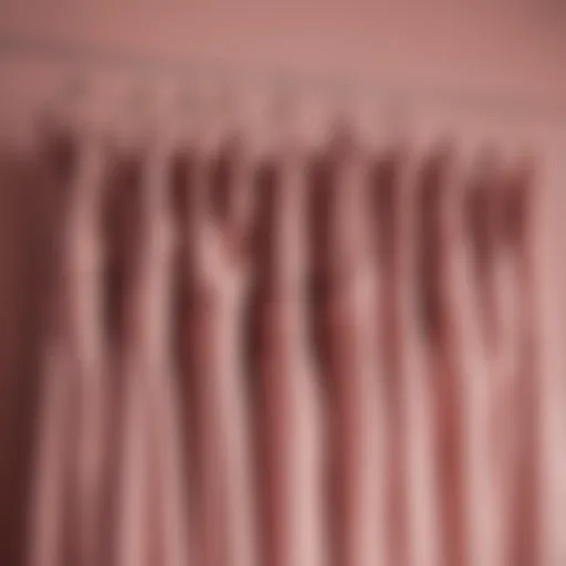 Elegant bridesmaid dresses in dusty rose draped elegantly on a hanger