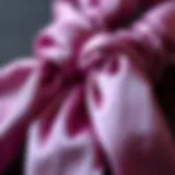 A close-up view of luxurious cord hair ties made from silk, showcasing their sheen and texture