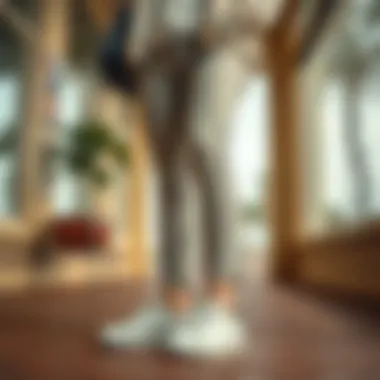 All-white leather sneakers paired with a stylish nursing outfit