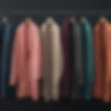 A collection of knee-length cardigans in various colors and designs hanging on a rack